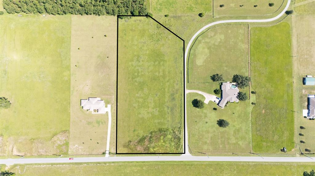 36365 Frazee Hill Road Dade City, FL 33523 - Photo 14 of 15 a bathroom with a glass shower door