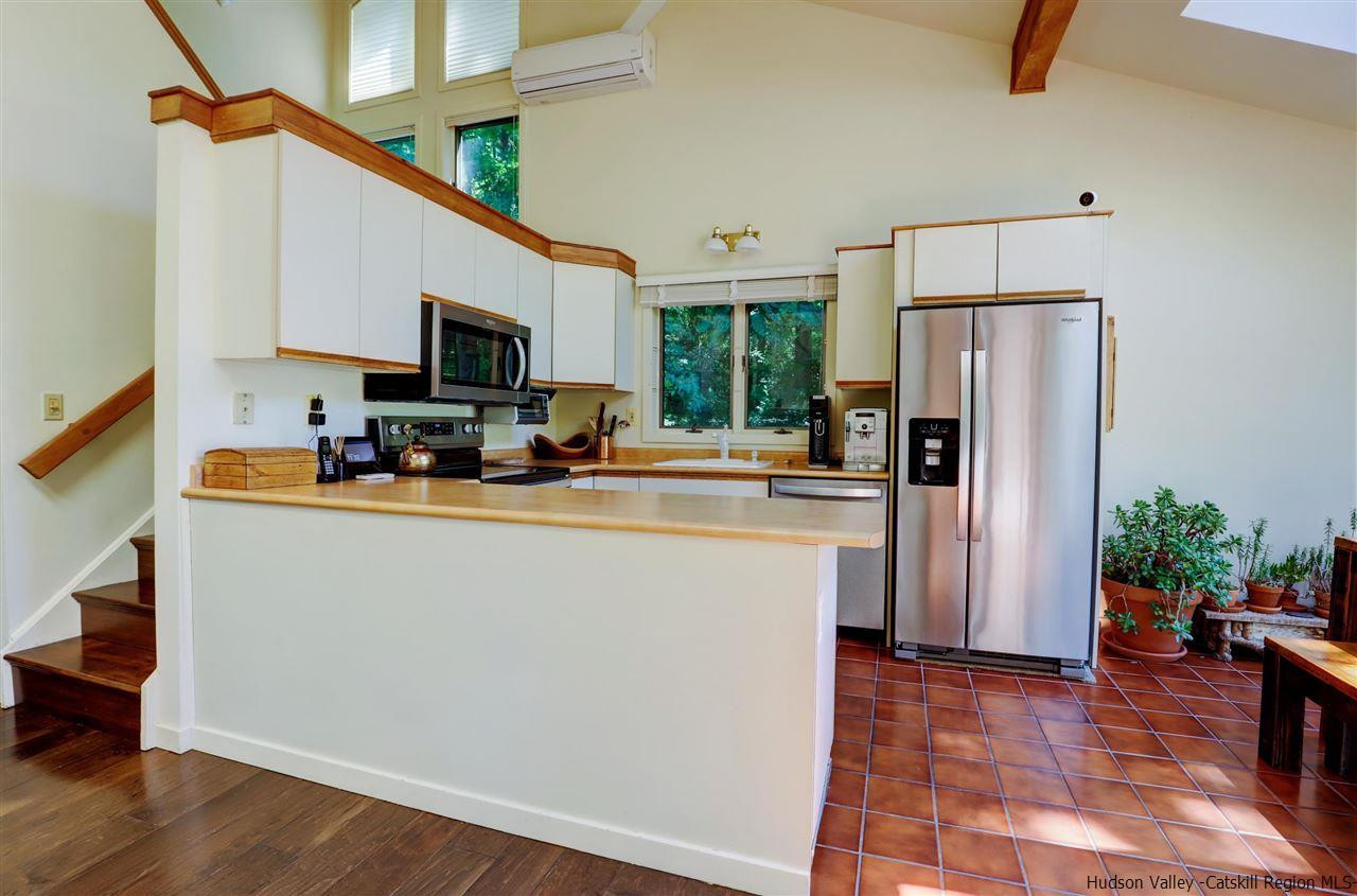 41 Mountain Road Mount Tremper, NY 12457 - Photo 14 of 33 a kitchen with stainless steel appliances a refrigerator stove microwave and sink