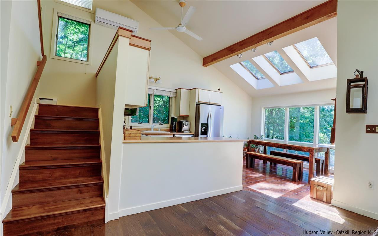 41 Mountain Road Mount Tremper, NY 12457 - Photo 16 of 33 a living room with furniture and a wooden floor
