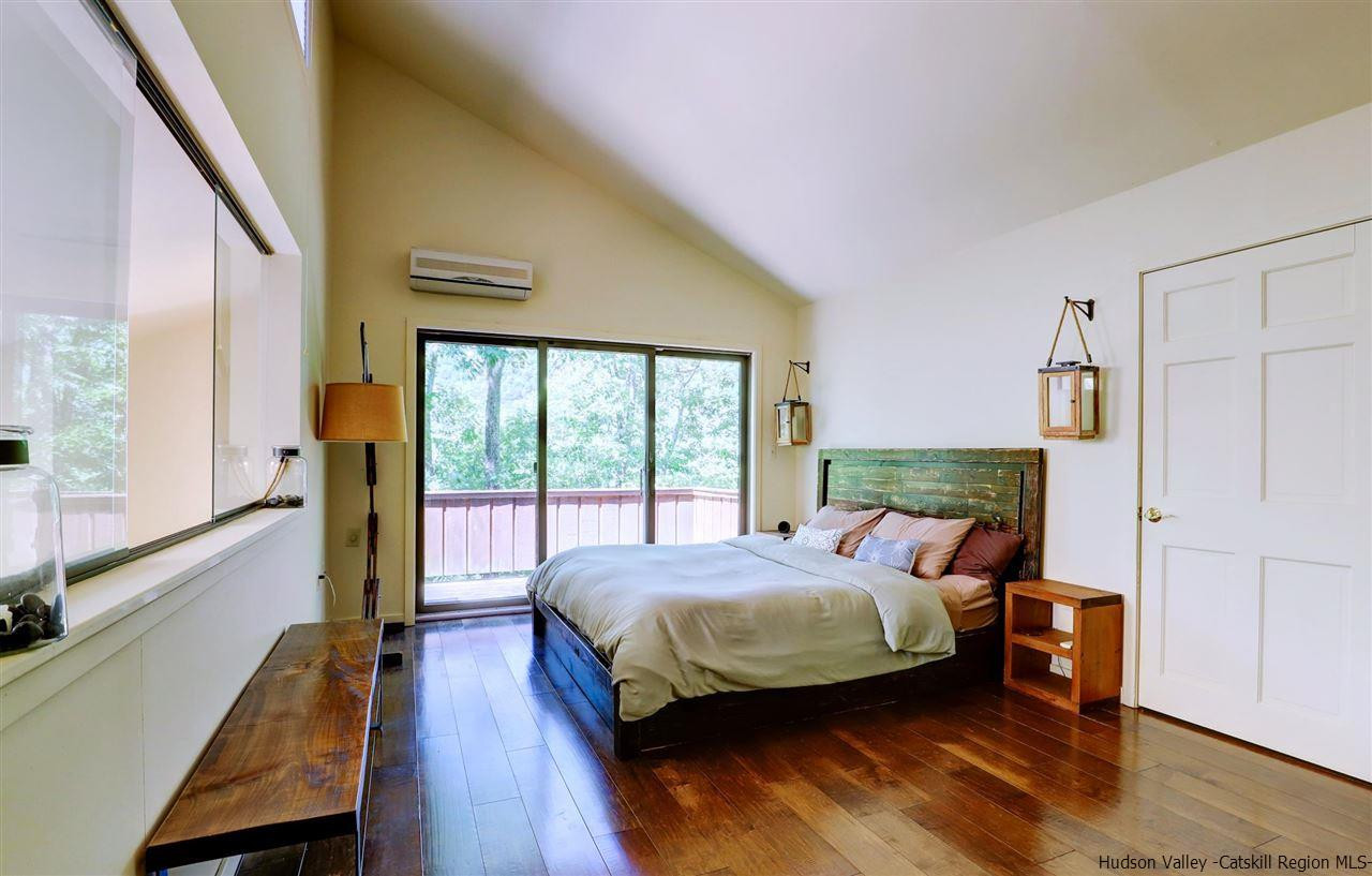 41 Mountain Road Mount Tremper, NY 12457 - Photo 17 of 33 a bedroom with a bed and a large window