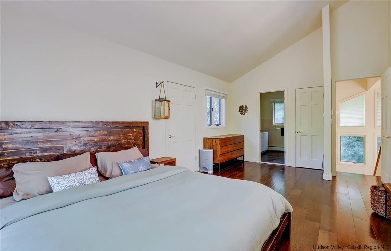 41 Mountain Road Mount Tremper, NY 12457 - Photo 18 of 33 a bedroom with furniture and wooden floor