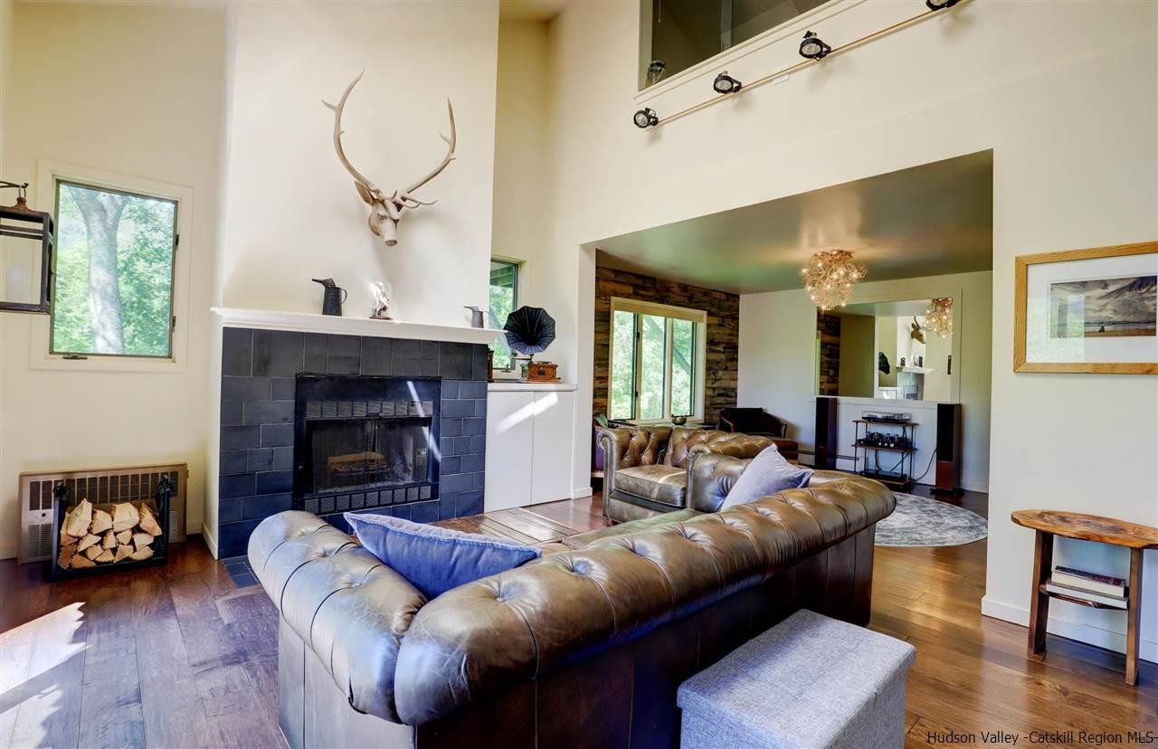 41 Mountain Road Mount Tremper, NY 12457 - Photo 4 of 33 a living room with furniture and a fireplace