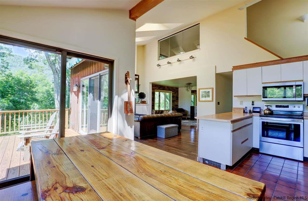 41 Mountain Road Mount Tremper, NY 12457 - Photo 5 of 33 a living room with fireplace furniture and a flat screen tv