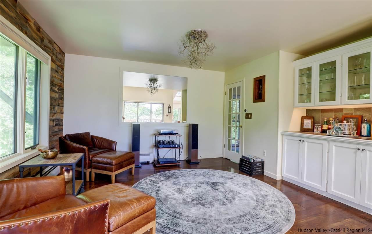 41 Mountain Road Mount Tremper, NY 12457 - Photo 8 of 33 a living room with furniture and a flat screen tv