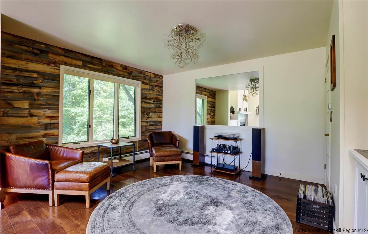 41 Mountain Road Mount Tremper, NY 12457 - Photo 9 of 33 a living room with furniture and a large window
