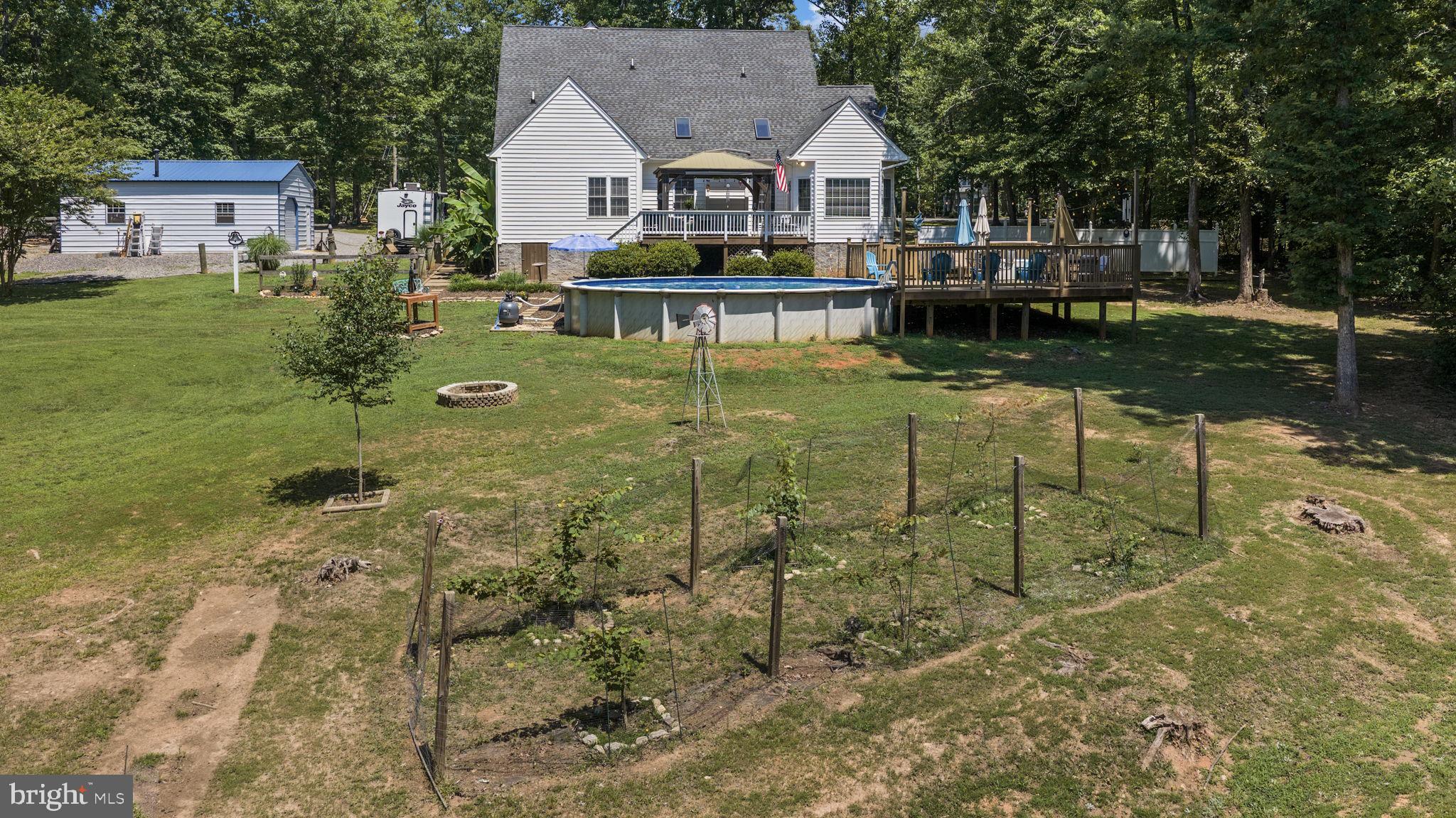 621 Ridgemont Drive Louisa, VA 23093 - Photo 55 of 81 Rear Exterior and Raised Beds