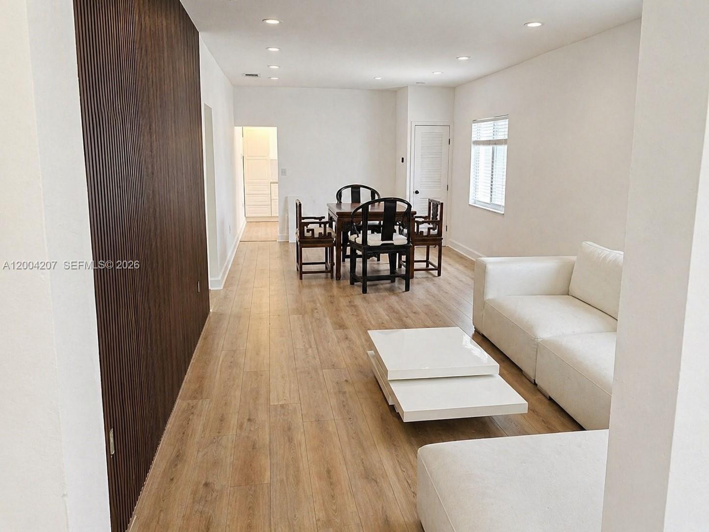 426 Southwest 26th Road Miami, FL 33129 - Photo 3 of 9 a living room with furniture and wooden floor