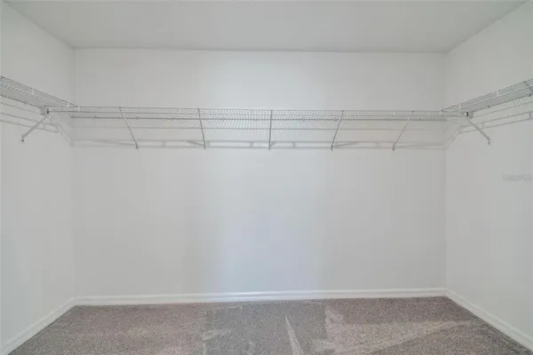 a view of a room with racks on the wall