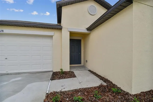 a front view of a house with a garage