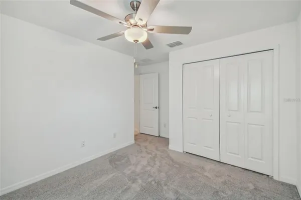 an empty room with fan