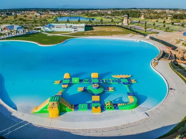 a view of a swimming pool with furniture