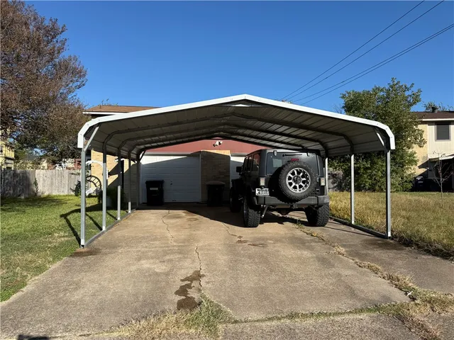 a view of a car parked in front of house
