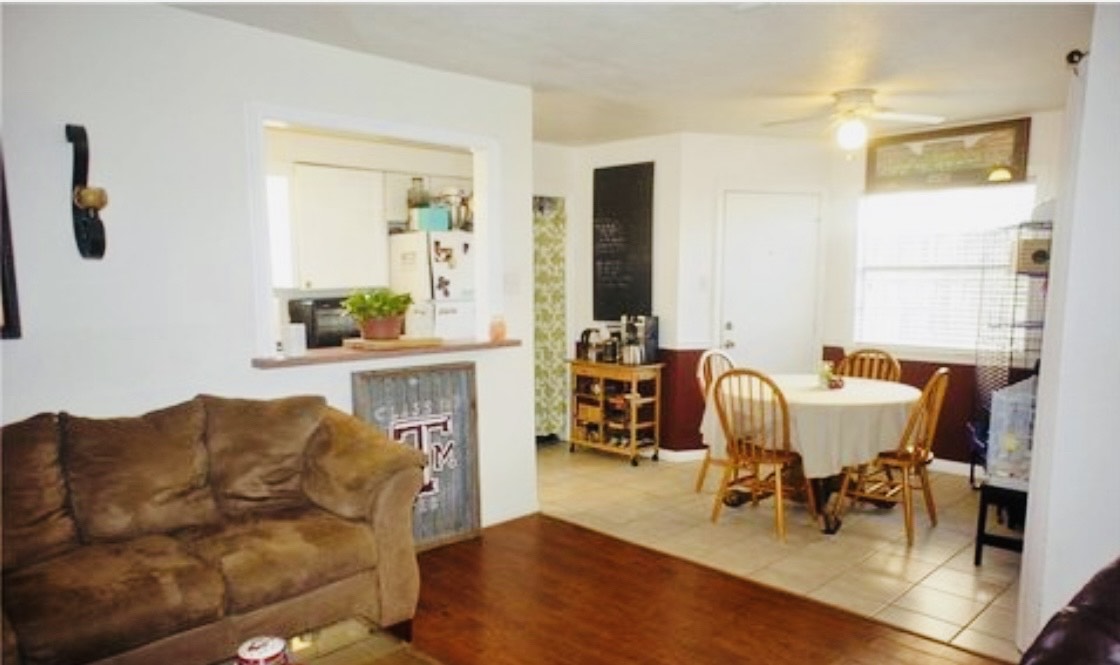 1409 Hawk Tree Drive College Station, TX 77845 - Photo 6 of 12 a living room with furniture and a fireplace
