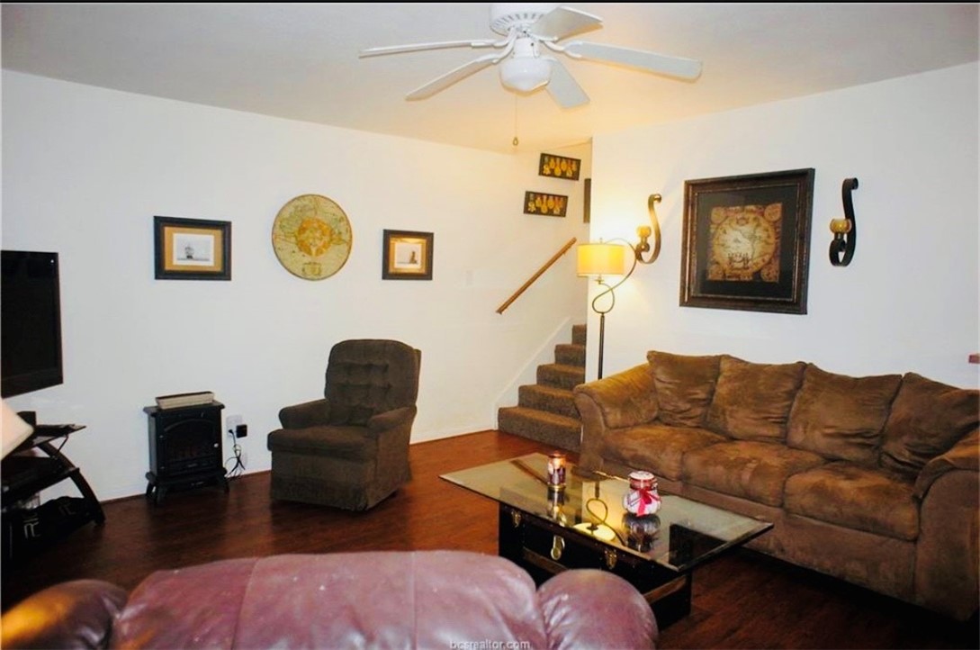 1409 Hawk Tree Drive College Station, TX 77845 - Photo 8 of 12 a living room with furniture and a flat screen tv