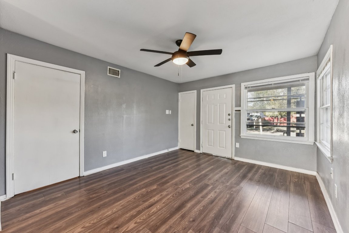 1102 Jackson Street Killeen, TX 76541 - Photo 6 of 16 wooden floor in an empty room with a window