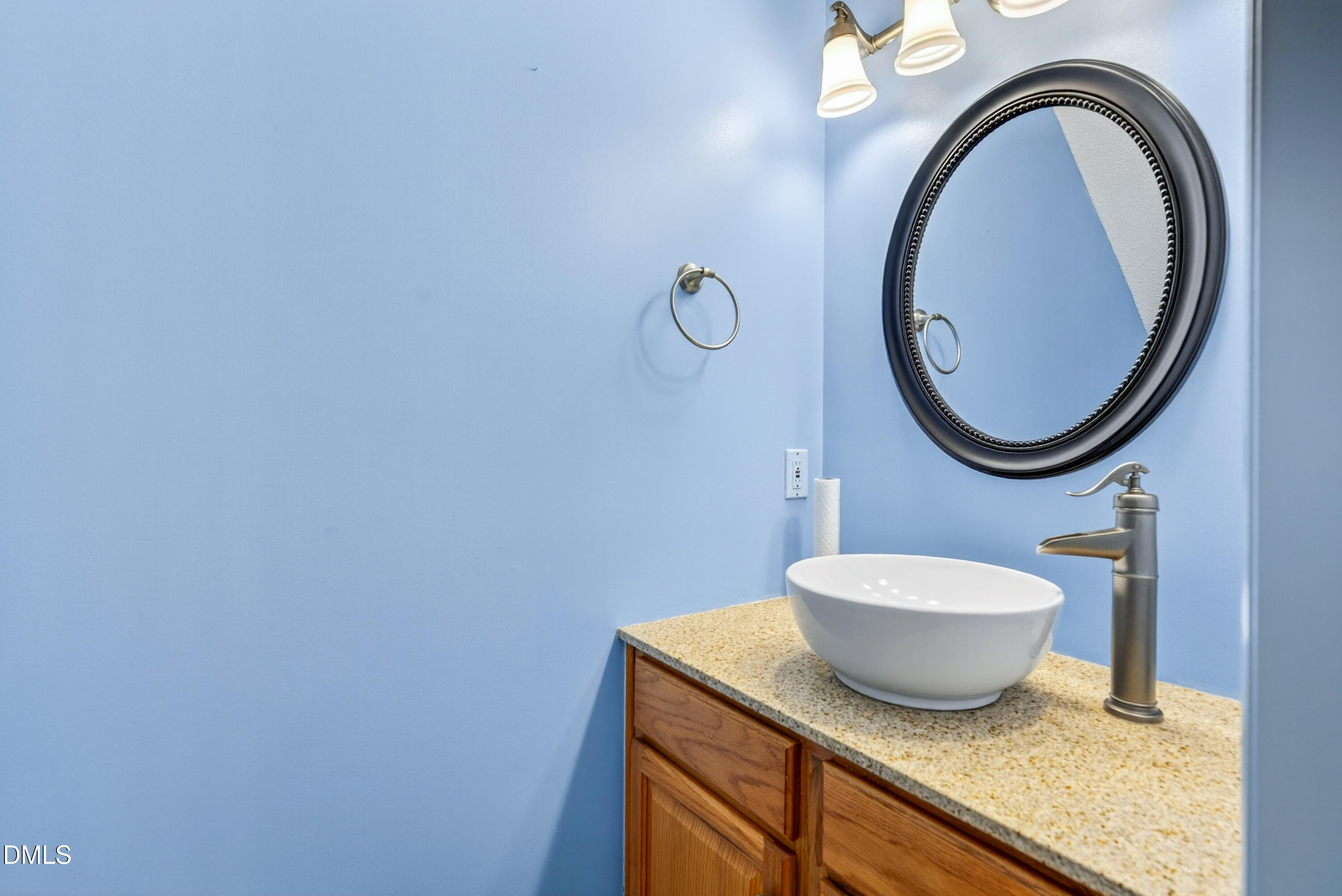 8724 Highmore Trail Raleigh, NC 27603 - Photo 21 of 39 Downstairs Half bath painted in pleasant blue.
