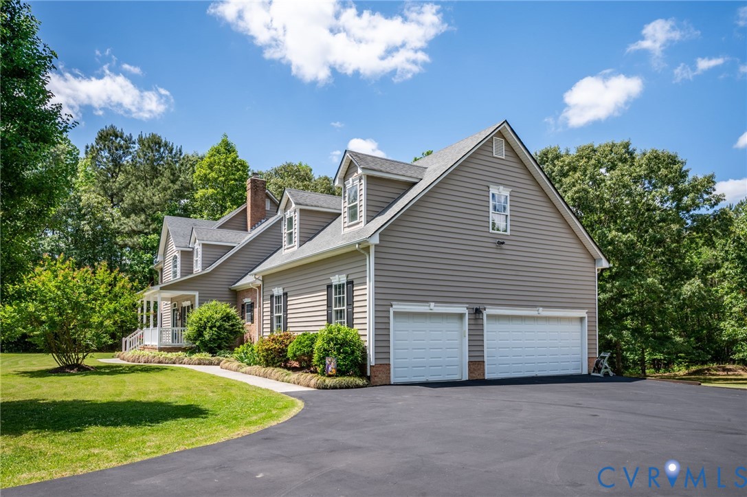 17170 Templeton Road Disputanta, VA 23842 - Photo 2 of 27 a front view of house with yard and green space