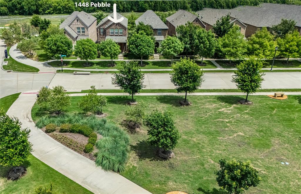 1448 Pebble Way Allen, TX 75013 - Photo 22 of 25 a view of a garden with a lake