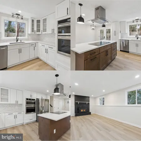 a large kitchen with stainless steel appliances kitchen island granite countertop a sink and cabinets