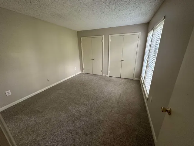 a bathroom with a double vanity sink and mirror
