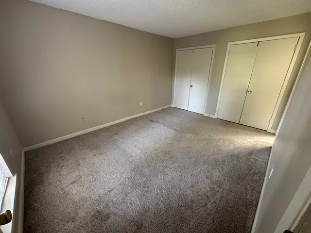 a view of a house with backyard and pool