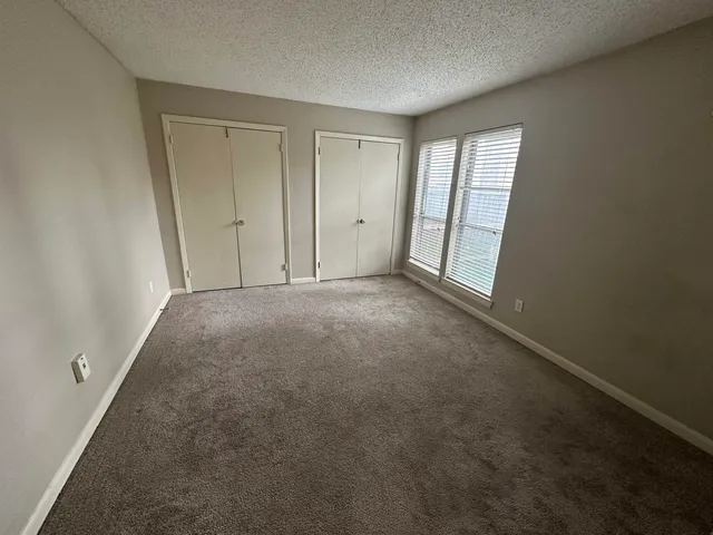 a bathroom with a sink a shower a mirror and a bathtub