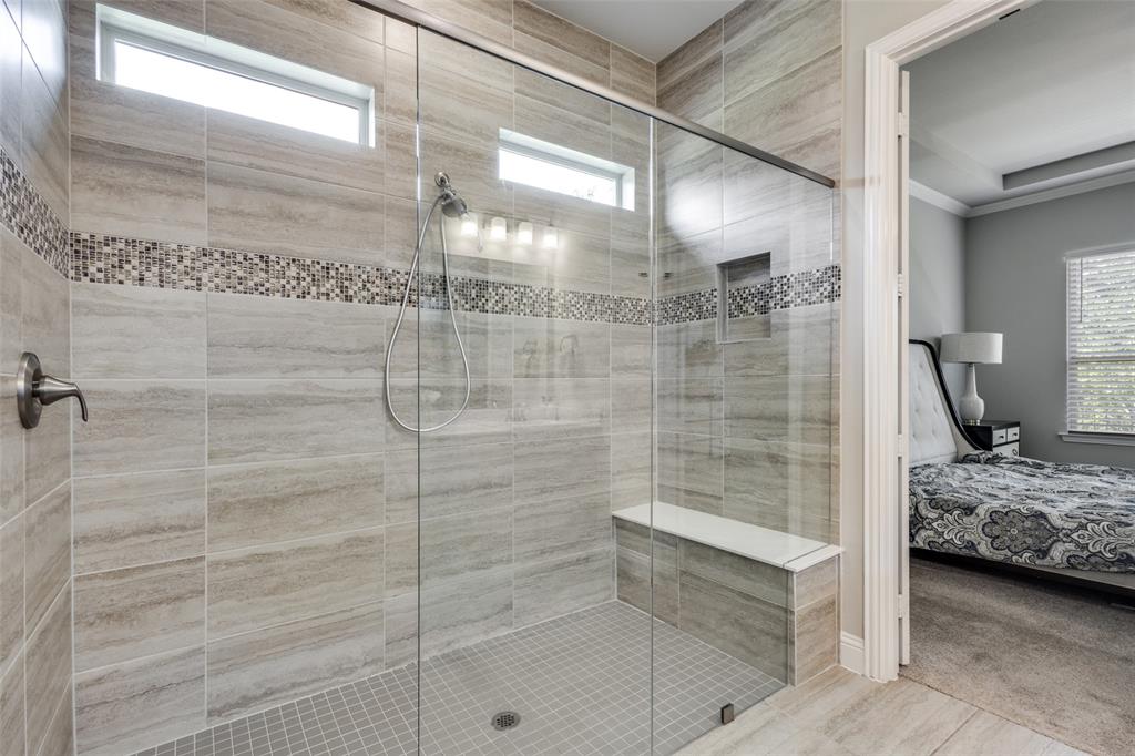 1113 Stone Bridge Pass Gunter, TX 75058 - Photo 16 of 32 a bathroom with a sink and shower