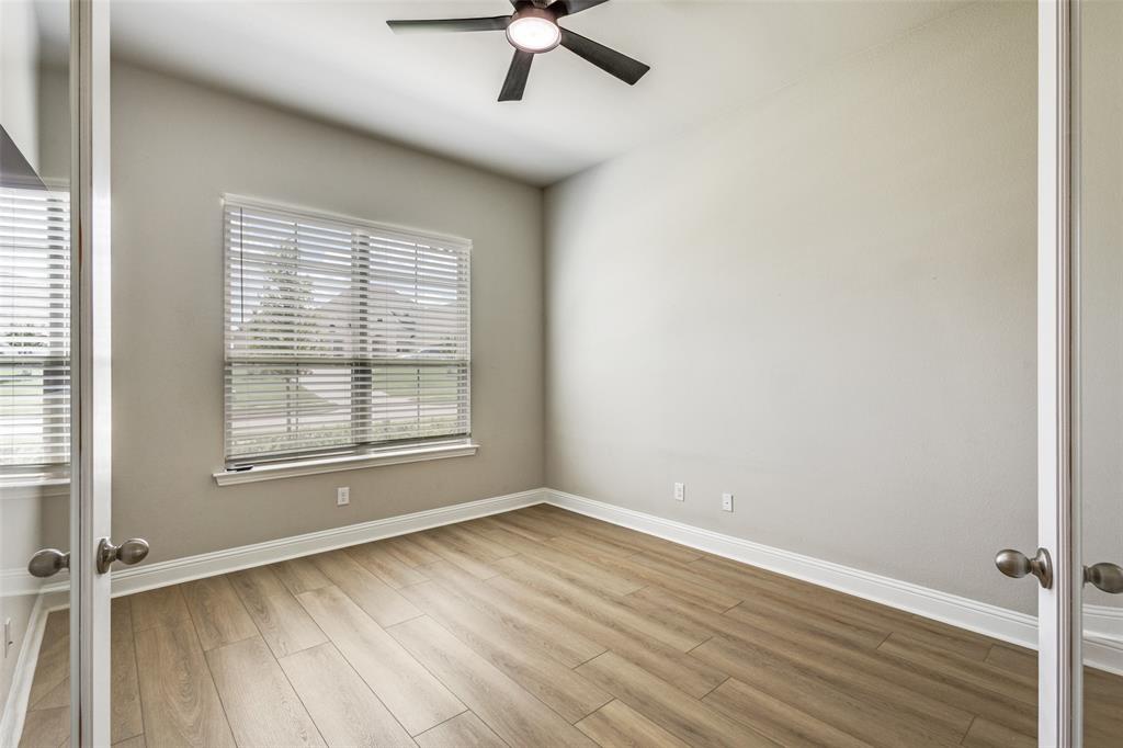 1113 Stone Bridge Pass Gunter, TX 75058 - Photo 22 of 32 wooden floor in an empty room with a window