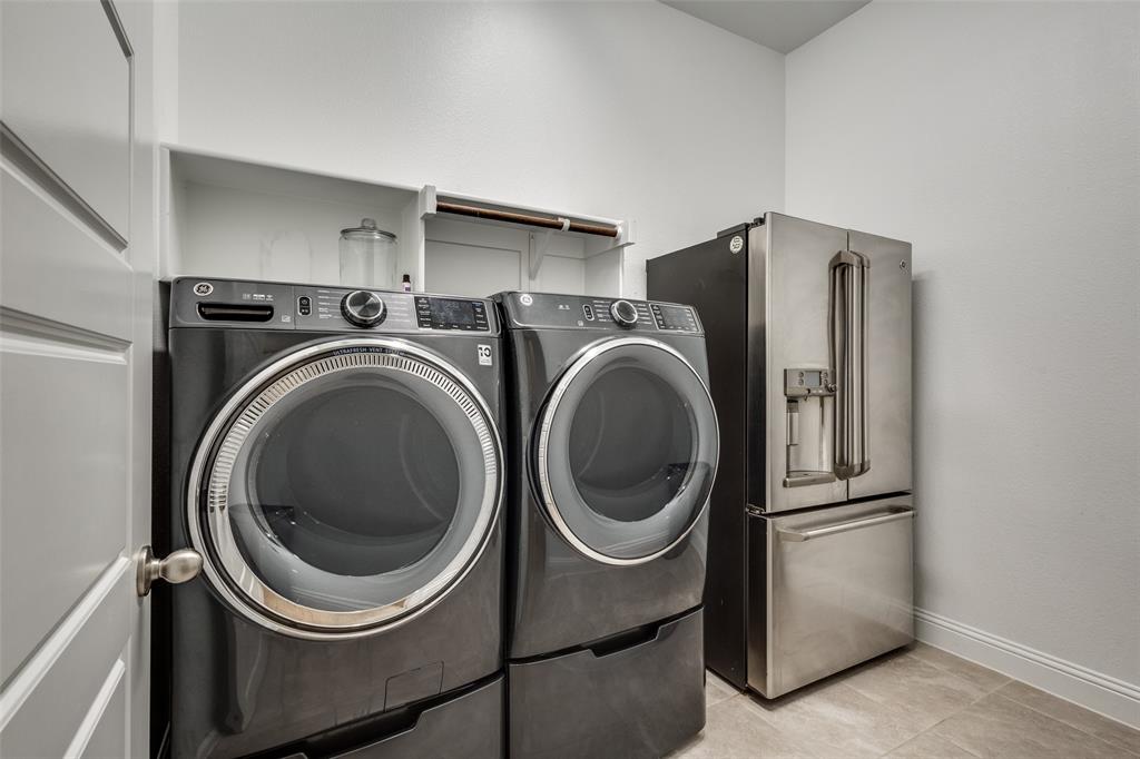 1113 Stone Bridge Pass Gunter, TX 75058 - Photo 23 of 32 a utility room with dryer and washer