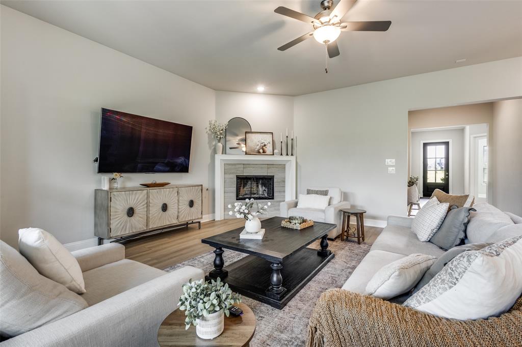 1113 Stone Bridge Pass Gunter, TX 75058 - Photo 3 of 32 a living room with furniture and a flat screen tv