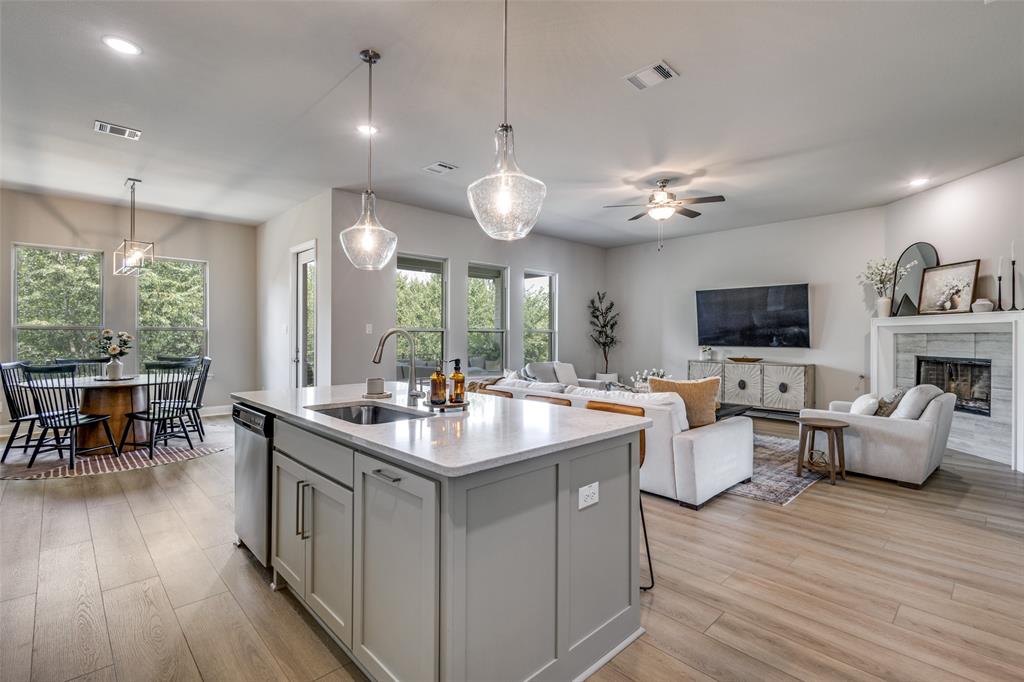 1113 Stone Bridge Pass Gunter, TX 75058 - Photo 6 of 32 a view of a dining room with furniture window and wooden floor
