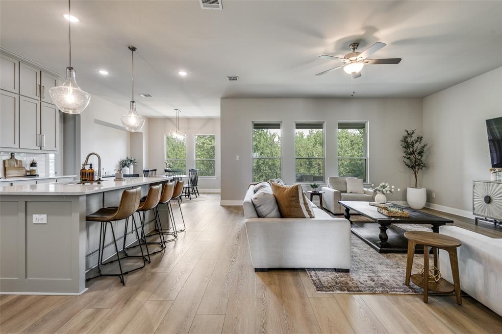 1113 Stone Bridge Pass Gunter, TX 75058 - Photo 9 of 32 a living room with furniture and a large window