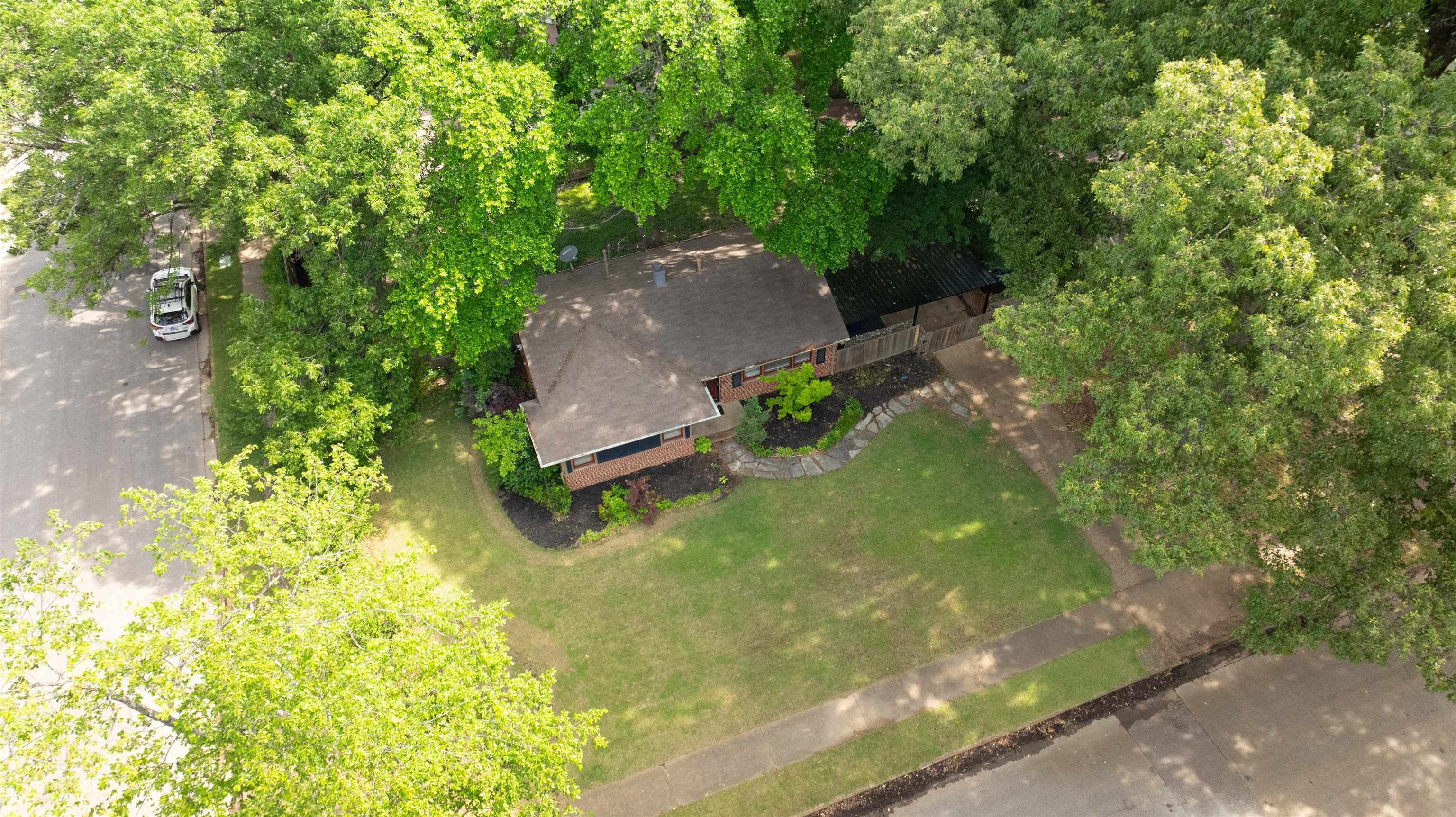 4564 Verne Road Memphis, TN 38117 - Photo 22 of 25 Brick exterior home surrounded by mature trees