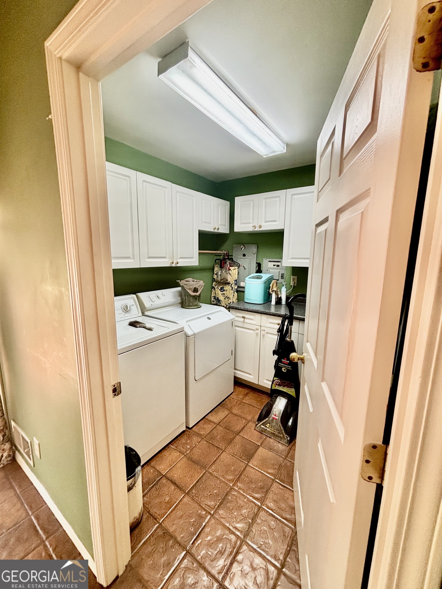 230 White Road Fayetteville, GA 30214 - Photo 17 of 38 a room with a sink a flat screen tv and a refrigerator