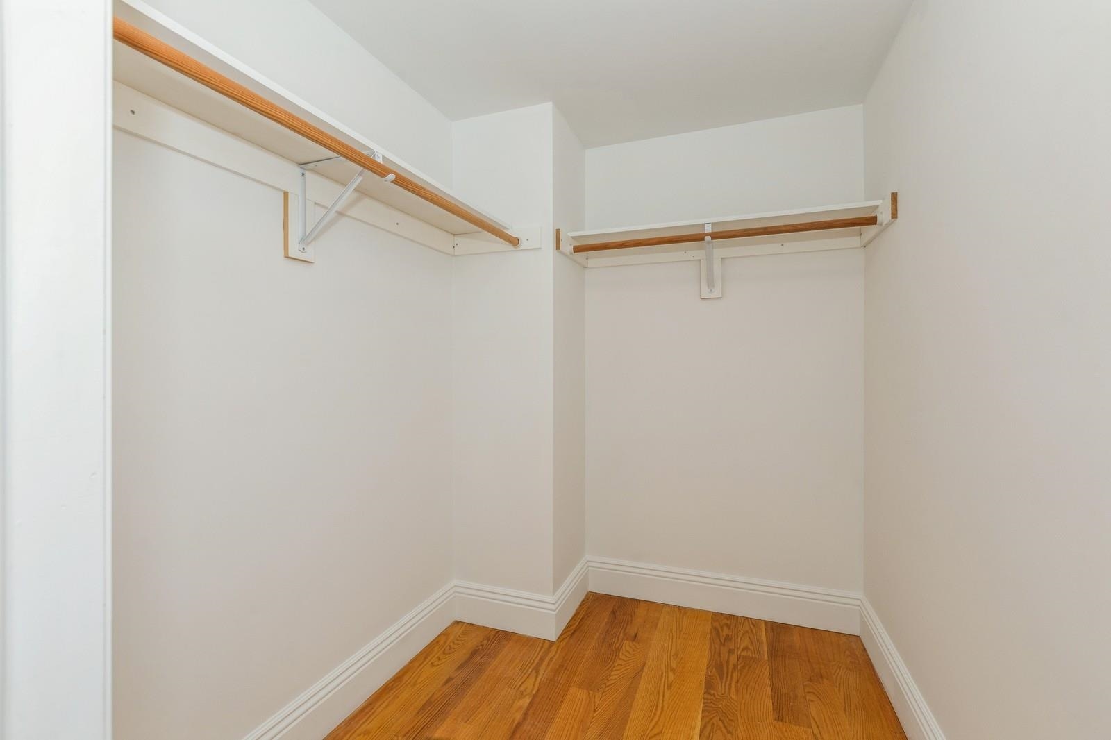 125 43rd Street, Unit 405 Union City, NJ 07087 - Photo 2 of 20 a view of walk in closet with empty racks