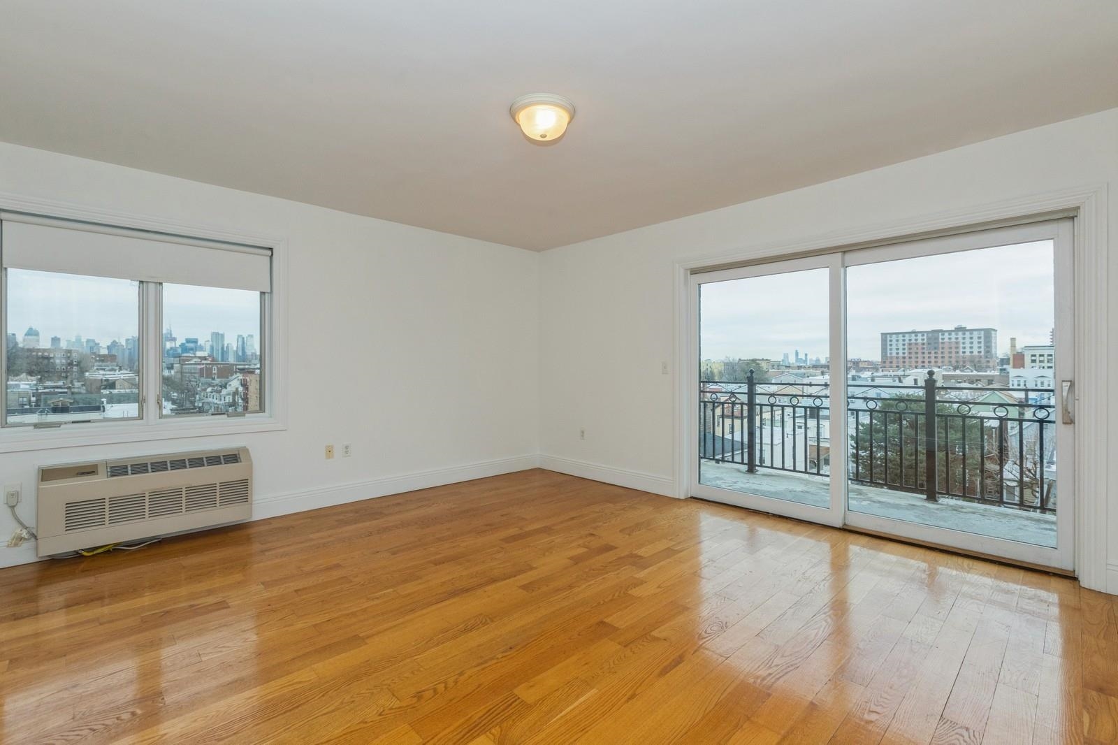 125 43rd Street, Unit 405 Union City, NJ 07087 - Photo 3 of 20 a view of an empty room with a window