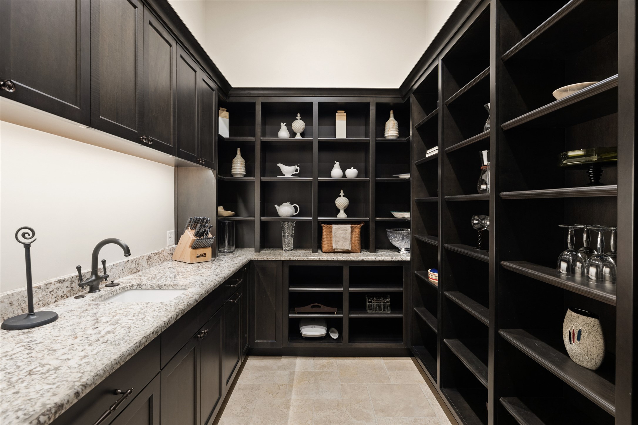 3667 Stoneridge Road Austin, TX 78746 - Photo 14 of 40 The butler’s pantry and additional storage keep entertaining seamless and behind the scenes.