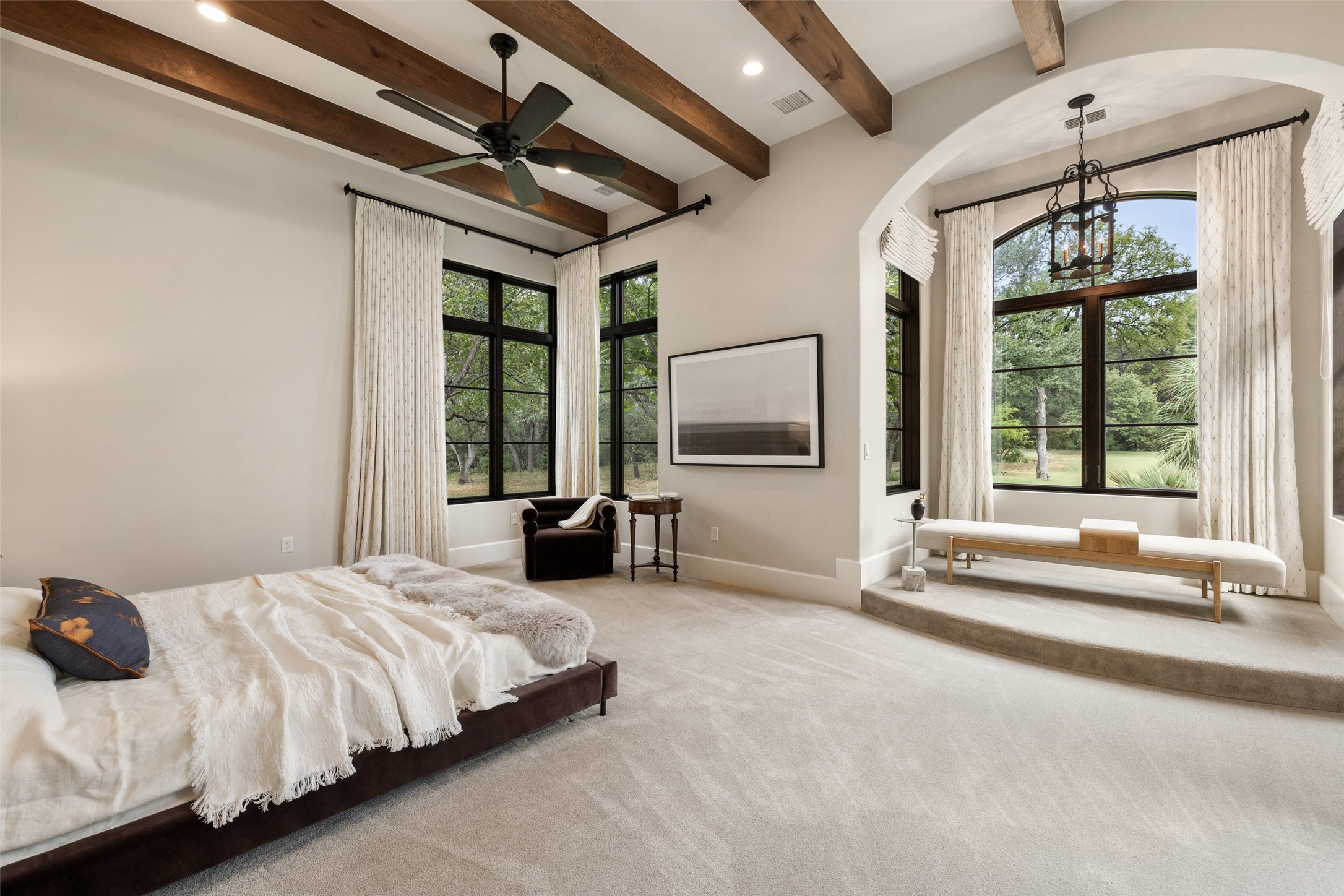 3667 Stoneridge Road Austin, TX 78746 - Photo 18 of 39 a spacious bedroom with a bed and a large window