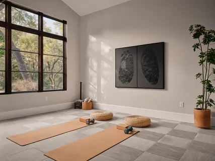 a living room with a couch and potted plant