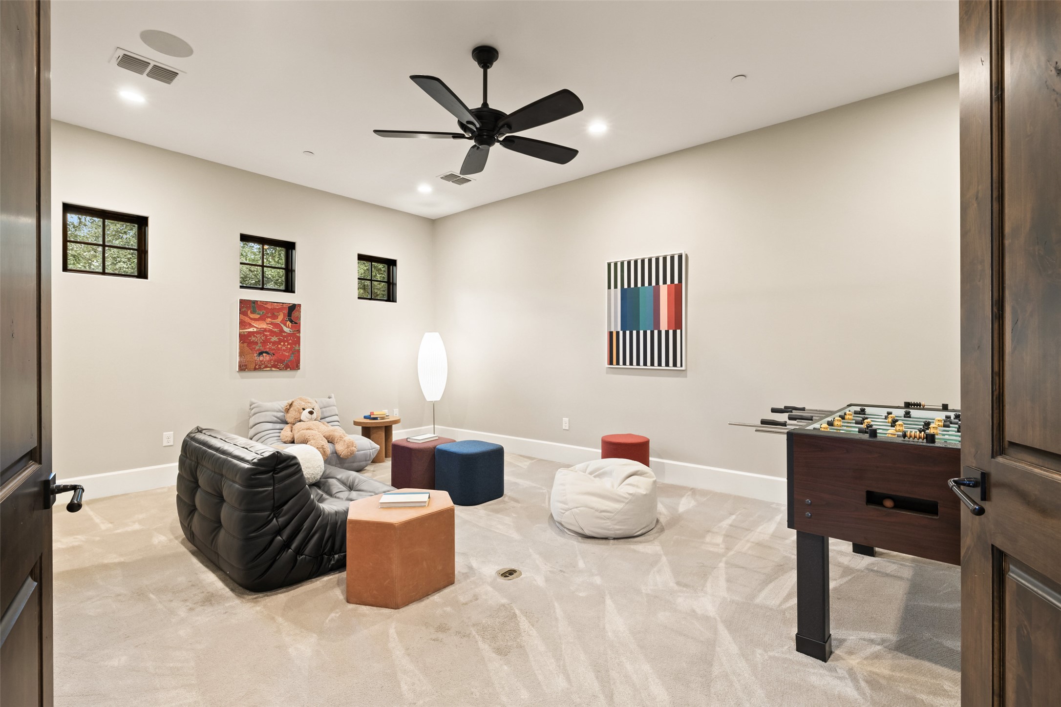 3667 Stoneridge Road Austin, TX 78746 - Photo 26 of 39 a living room with furniture and a ceiling fan