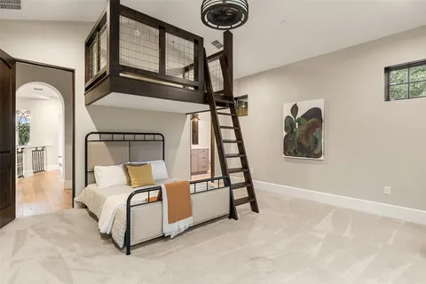 a bed room with a bed and a chandelier