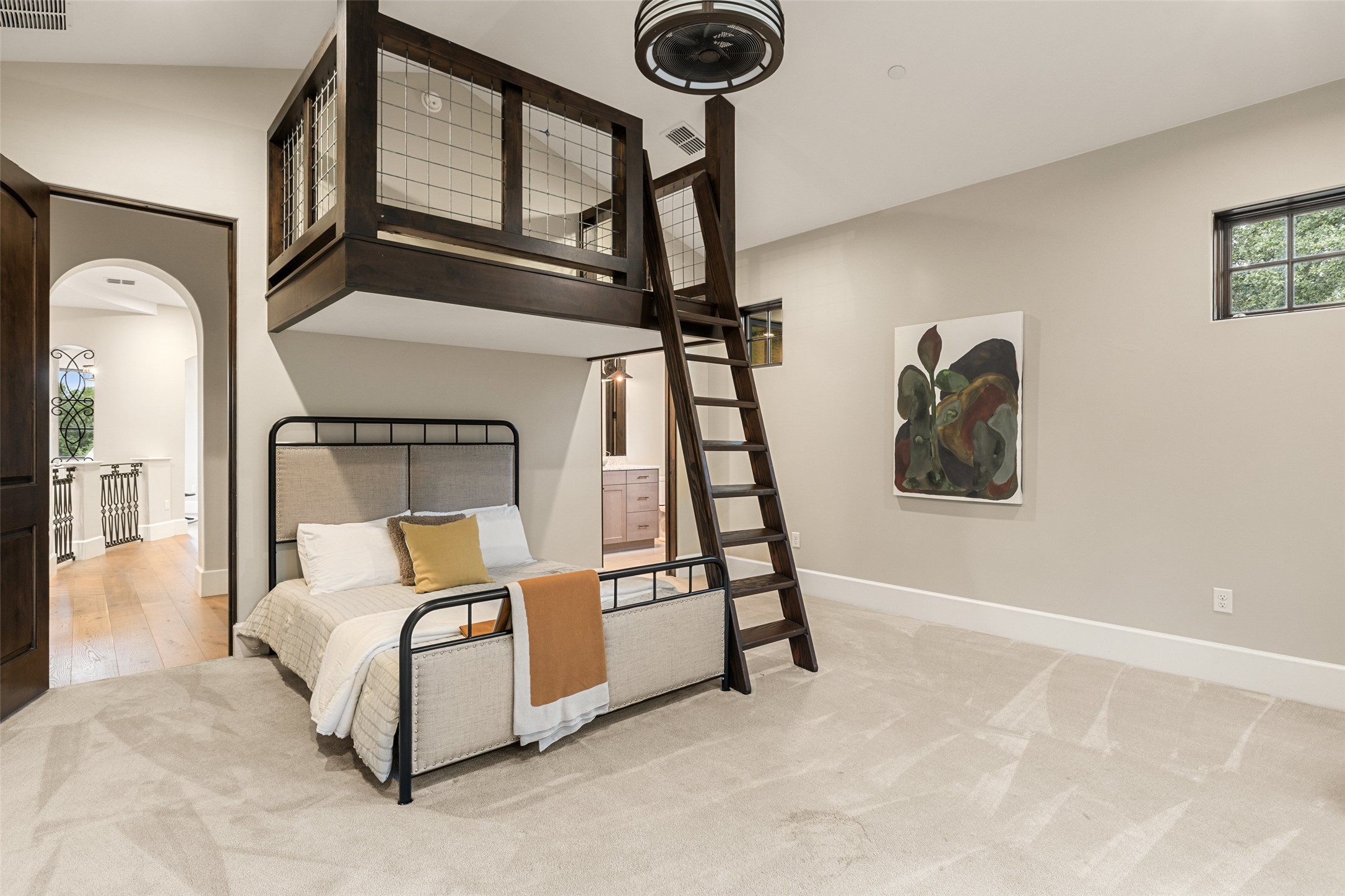 3667 Stoneridge Road Austin, TX 78746 - Photo 27 of 39 a bed room with a bed and a chandelier