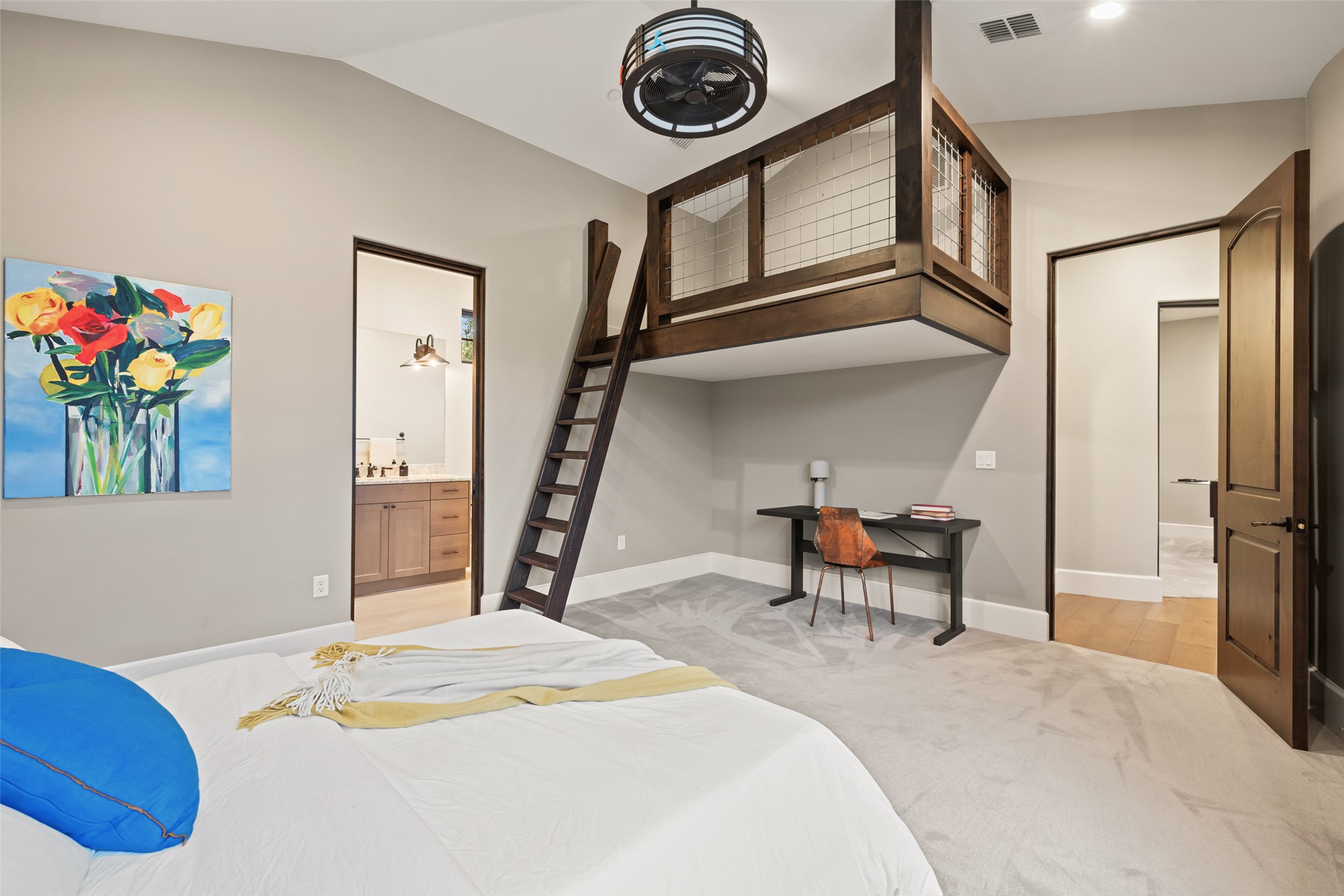 3667 Stoneridge Road Austin, TX 78746 - Photo 28 of 39 a bedroom with a bed and a chandelier