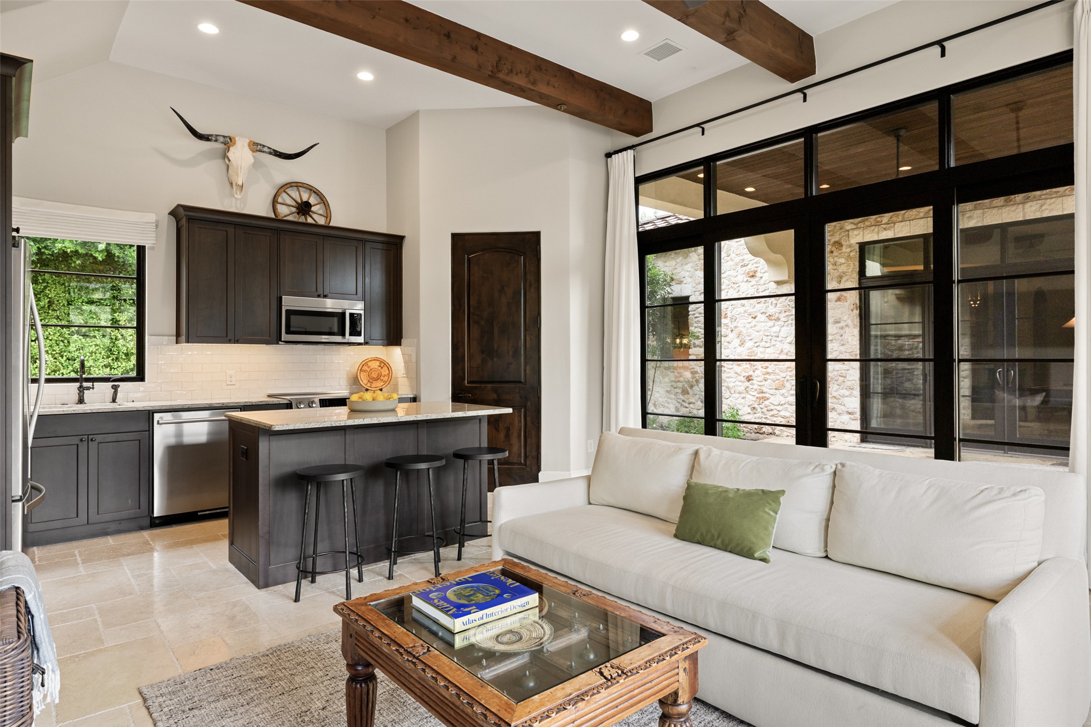 3667 Stoneridge Road Austin, TX 78746 - Photo 30 of 39 a living room with furniture and a flat screen tv