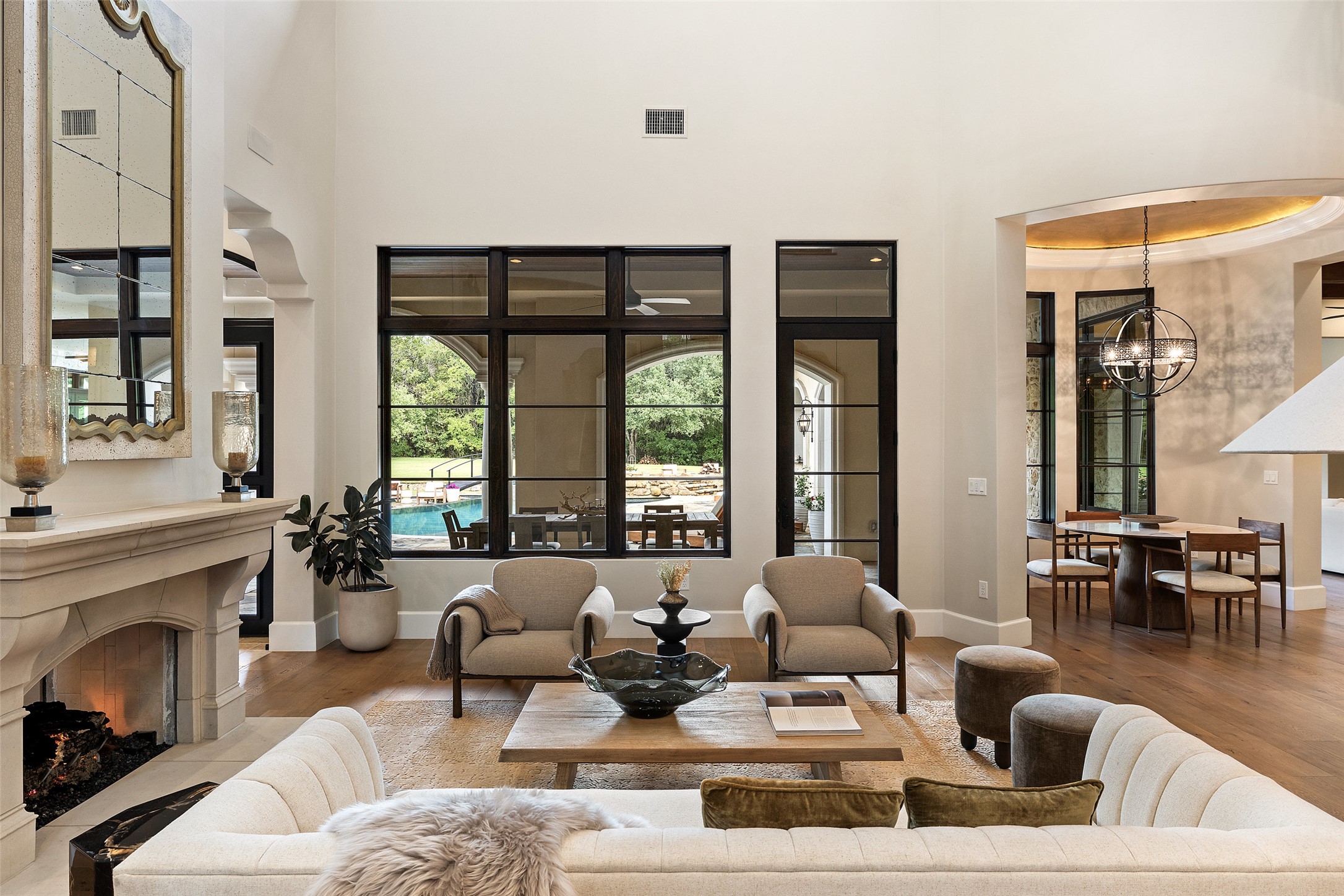 3667 Stoneridge Road Austin, TX 78746 - Photo 7 of 39 a living room with furniture large window and fireplace