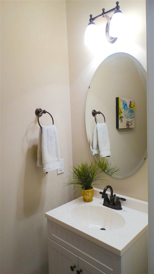 1308 Trinity Circle Raleigh, NC 27607 - Photo 19 of 25 A convenient Powder Room - with a vanity - for your guests to use on the first floor! Powder Room