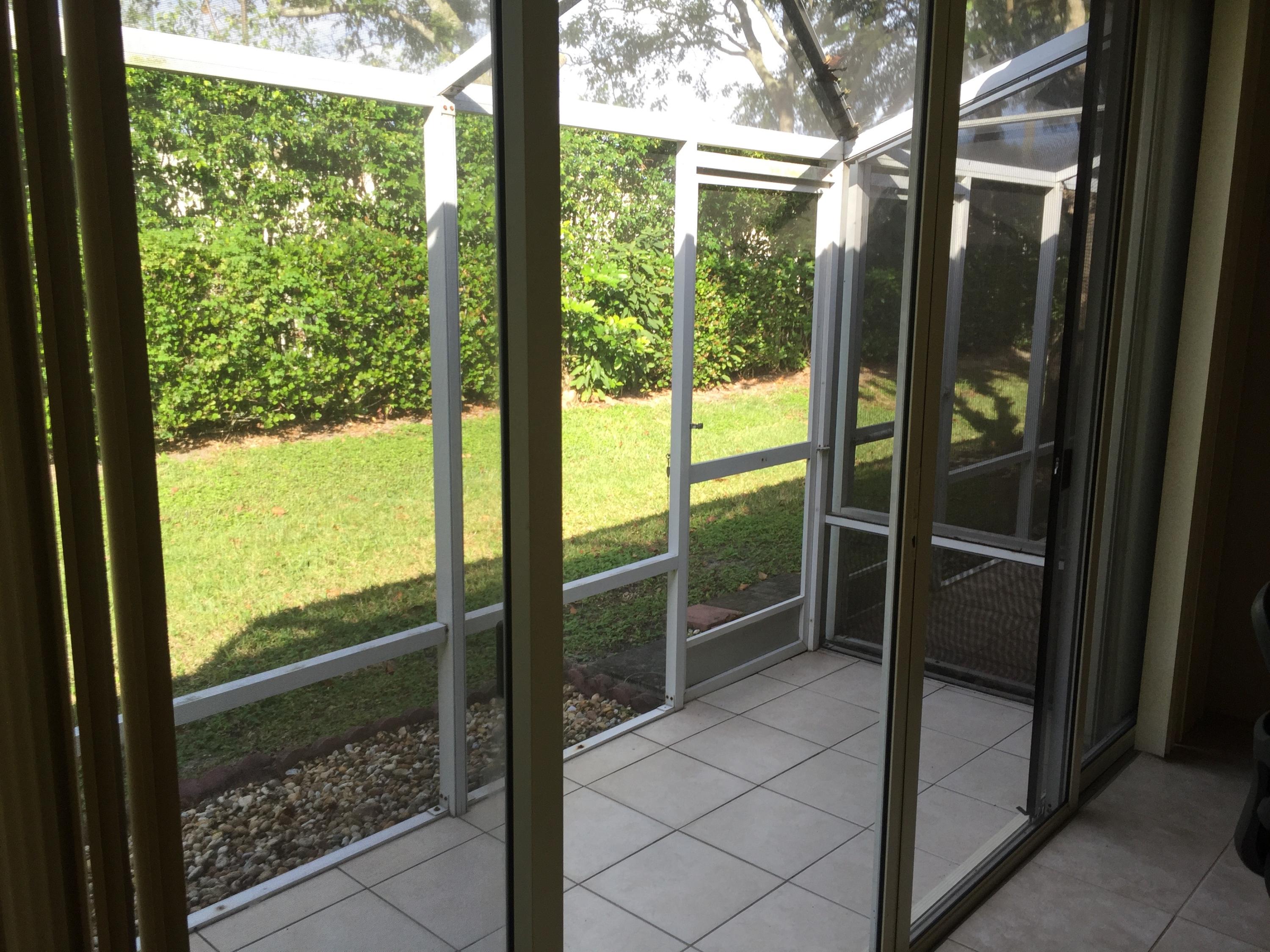 6057 Petunia Road Delray Beach, FL 33484 - Photo 2 of 18 Rear Patio