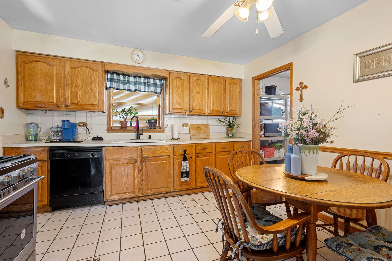 10741 Mason Avenue Chicago Ridge, IL 60415 - Photo 11 of 23 a kitchen with a dining table chairs and white appliances