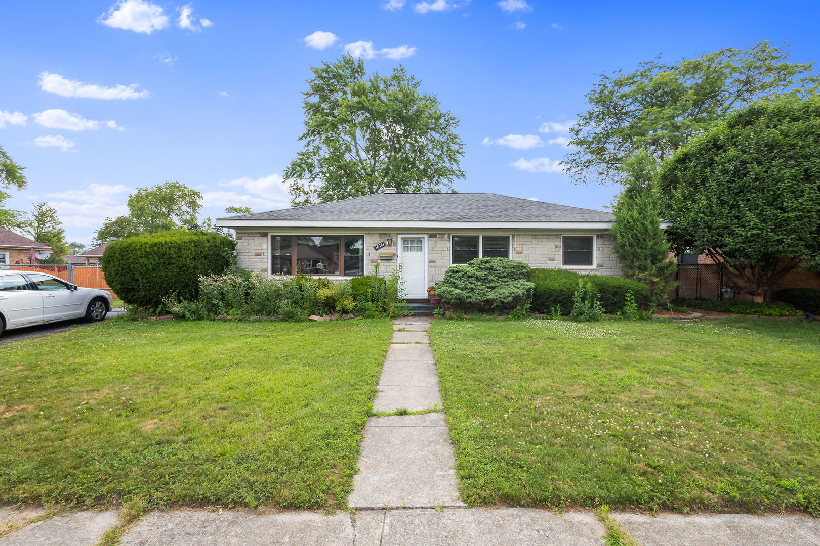 10741 Mason Avenue Chicago Ridge, IL 60415 - Photo 22 of 23 a front view of a house with a yard