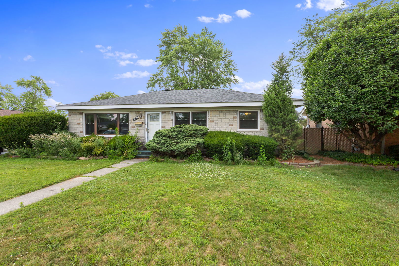 10741 Mason Avenue Chicago Ridge, IL 60415 - Photo 23 of 23 a front view of a house with a yard and trees
